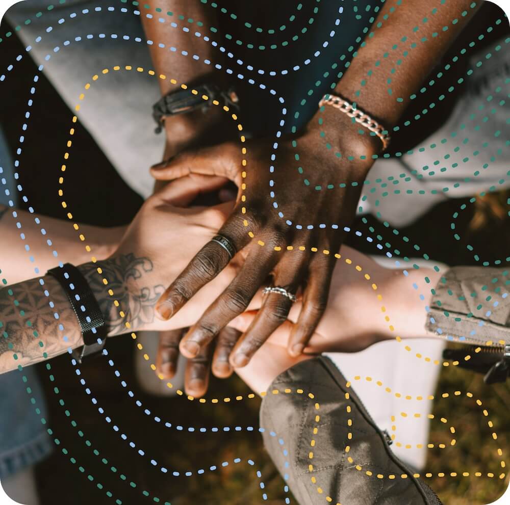 Photo of hands stacked as a team effort